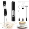 Electric milk frother with multiple attachments and USB cable, on white background with milk splatter and coffee cup.