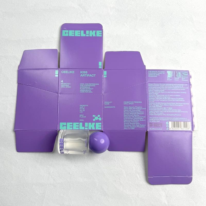 CEELIKE Kiss Artifact Spray Oral Refrescante packaging with purple boxes and clear bottle on white background.